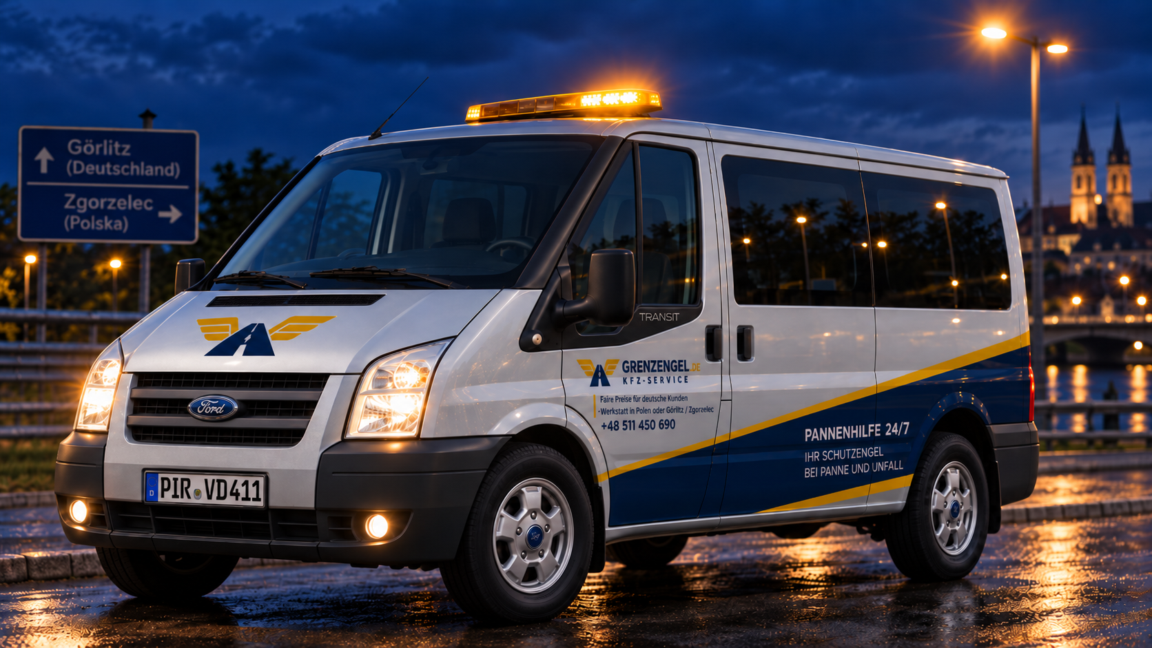 Silberner Ford Transit von GRENZENGEL.DE als mobiles Servicefahrzeug mit gelber Warnleuchte und KFZ-Service-Werbung.